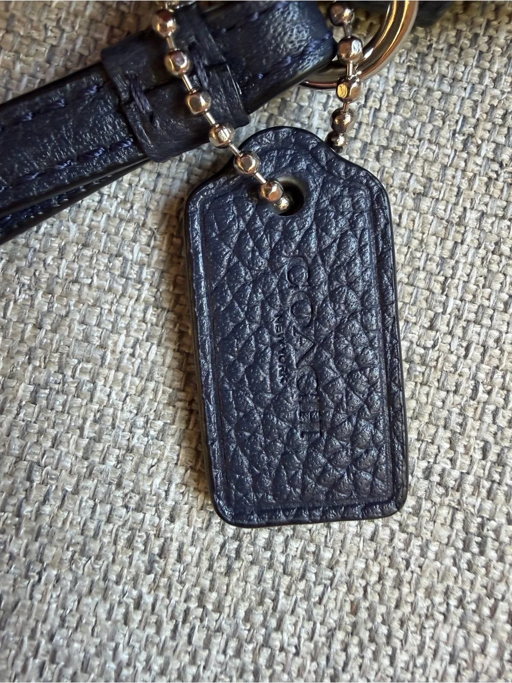 Coach Navy Pebbled Leather Wristlet with Gold Logo